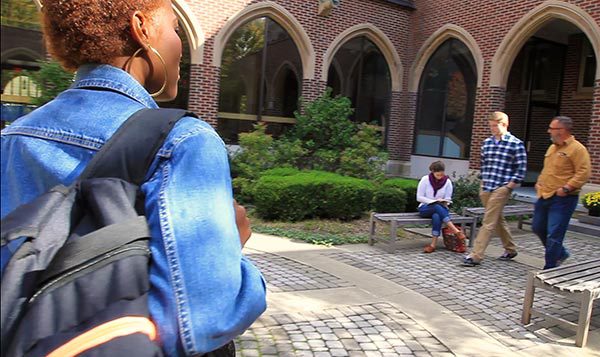 students walking in Marian Hall Courtyard