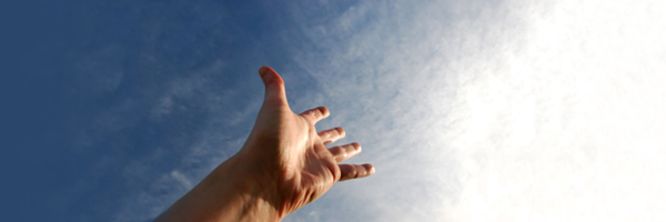 hand reaching towards sky