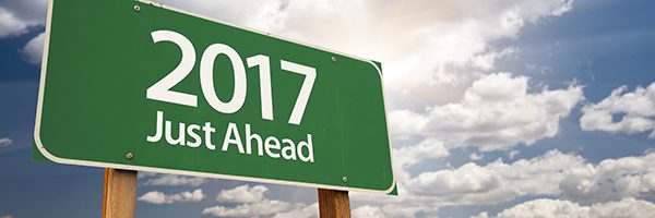 2017 Just Ahead Green Road Sign Against Dramatic Clouds and Sky.