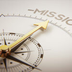 an arrow on a compass pointing towards the words mission