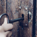 opening a wooden door with a skeleton key