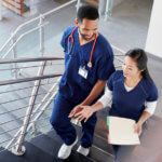 two nurses walking up stairs