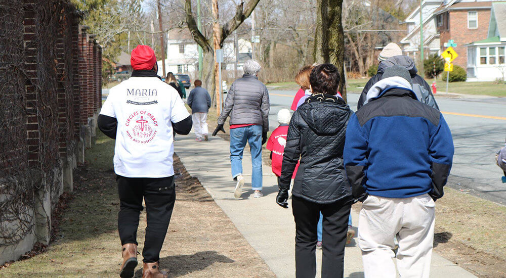 people waling along New Scotland Avenue during the Walk for Mercy event