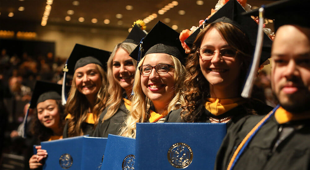 Smiling Commencement Students