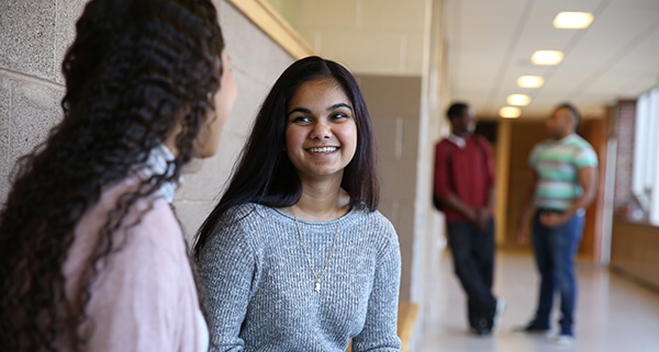 Smiling Students in Hallway