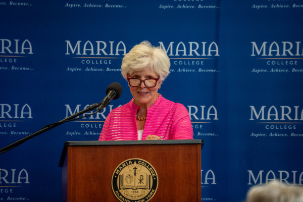 Dr. Mary Jo LaPosta speaks at podium